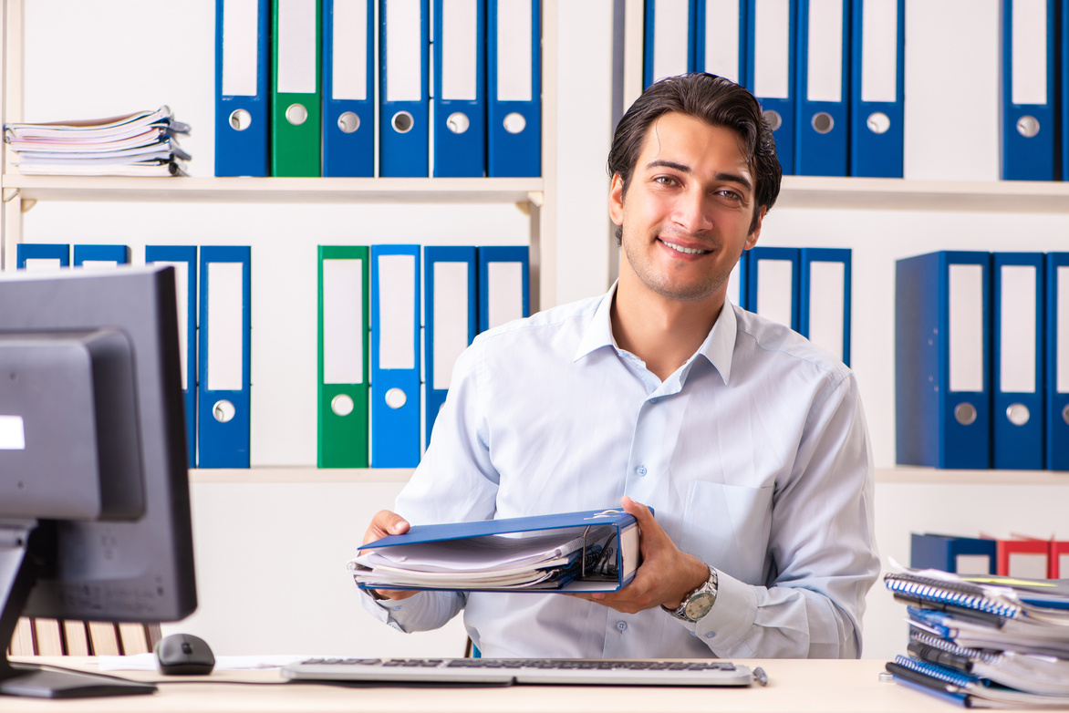 Young Male Employee Working in the Office